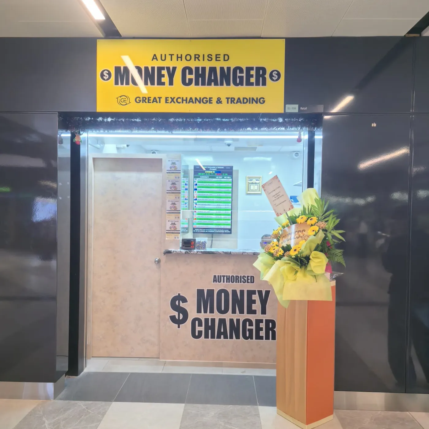 Punggol Coast counter at unit #01-308 with the yellow Authorised Money Changer sign